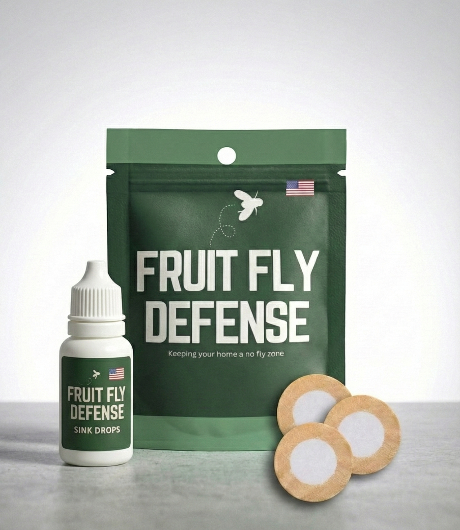 Fruit Fly Defense product packaging with a bottle and patches on a gray surface. Industry leading fruit fly deterrent meant for homes, kitchens, commercial applications.