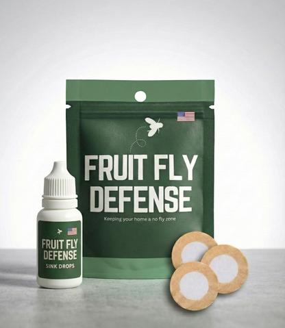 Fruit Fly Defense product packaging with a bottle and patches on a gray surface. Industry leading fruit fly deterrent meant for homes, kitchens, commercial applications.