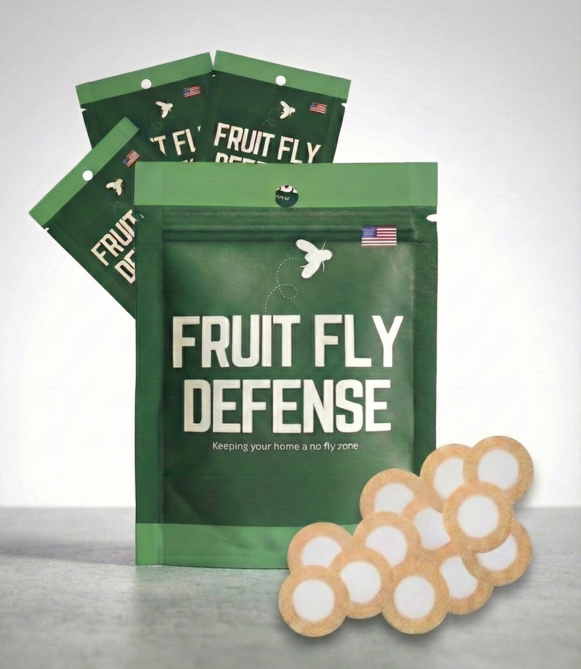 Green 'Fruit Fly Defense' packaging with a small fruit fly model on a gray surface. Industry leading fruit fly deterrent meant for homes, kitchens, commercial applications.